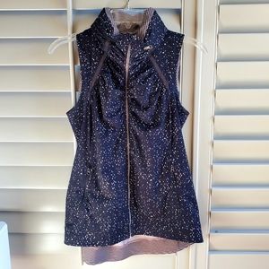 Lululemon sleeveless jacket with hidden hood when needed.  Black & pink speckles